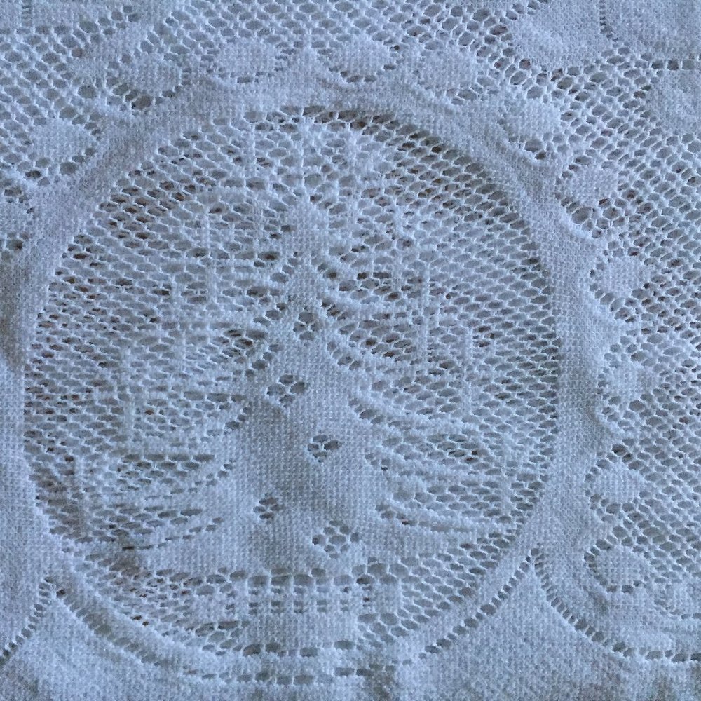 White crochet table cloth for christmas or other holidays